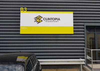 Industrial park unit sign made from aluminium with printed vinyl graphic fixed to cladding