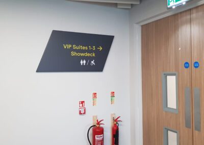 Teca Event Complex Aberdeen directional sign on wall