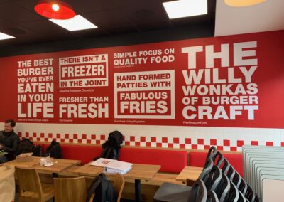 Custom printed wallpaper inside Five Guys restaurant