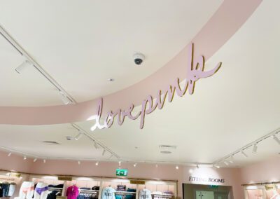 Curved Love Pink letters inside Victoria's Secret