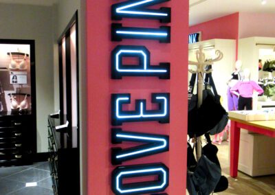 Illuminated Love Pink letters on wall inside Victoria's Secret Store Edinburgh Scotland