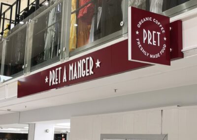 Pret A Manger shopfront with non illuminated fascia sign and projecting sign