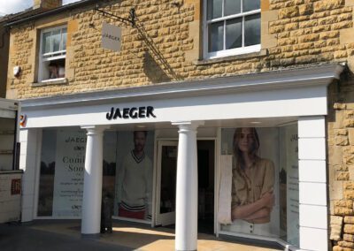 Jaeger shopfront with fascia sign and projection sign