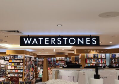 internally illuminated waterstones hanging sign