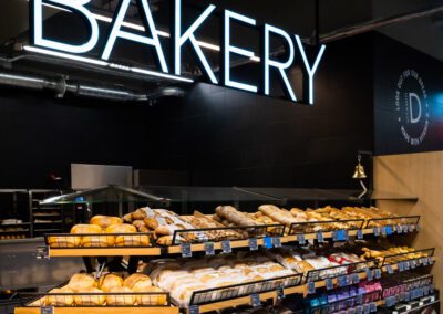 M&S bakery hanging signs with rail mounted illuminated letters