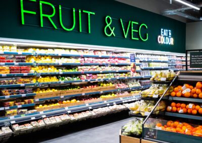 Rail mounted letters on wall of fruit & veg section at M&S Exmouth